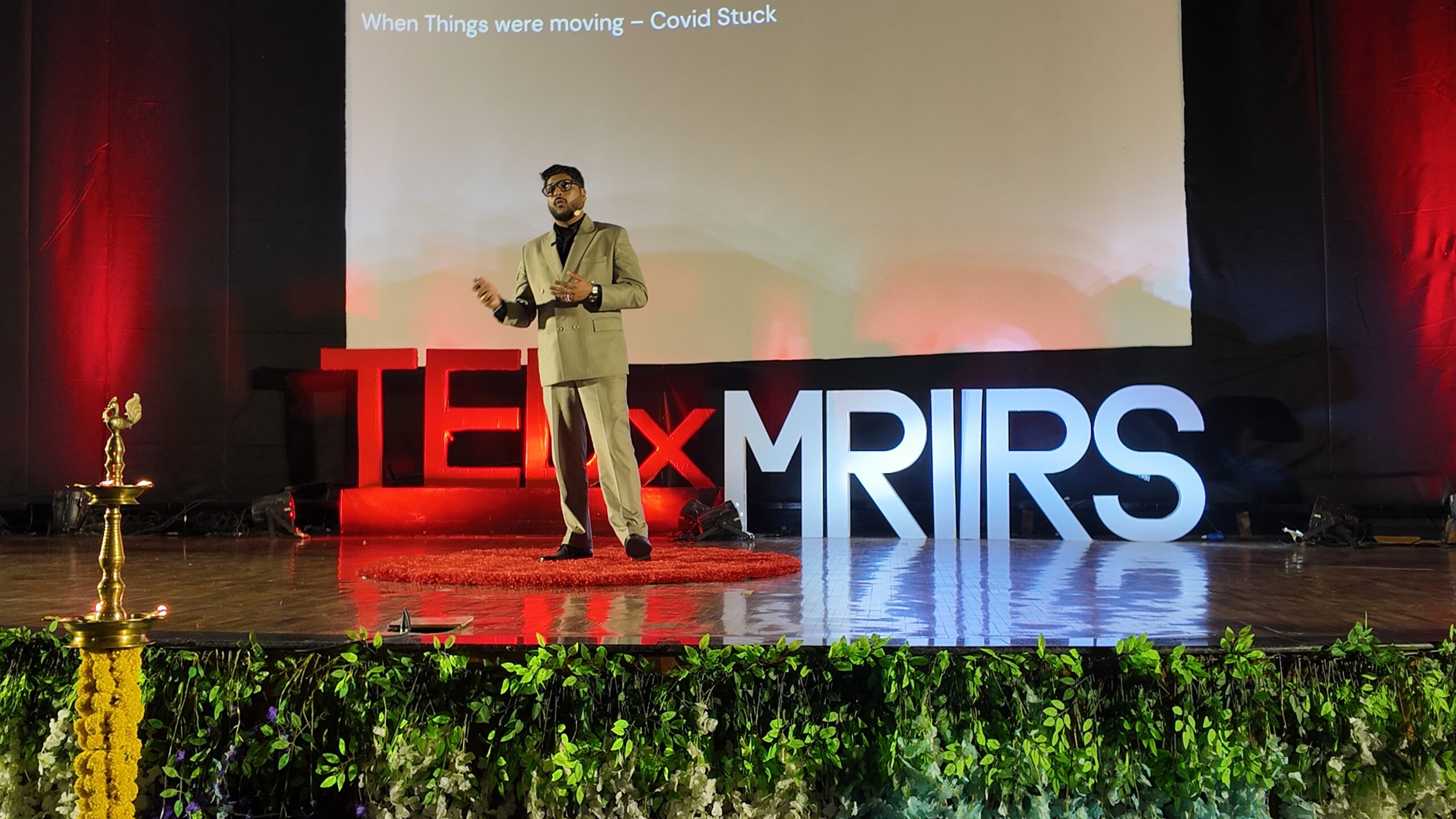 Soundar Rajan speaking on a TEDx stage